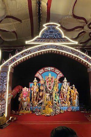 Illuminated arch framing Durga tableau, South Bangalore Cultural Association (SBCA)