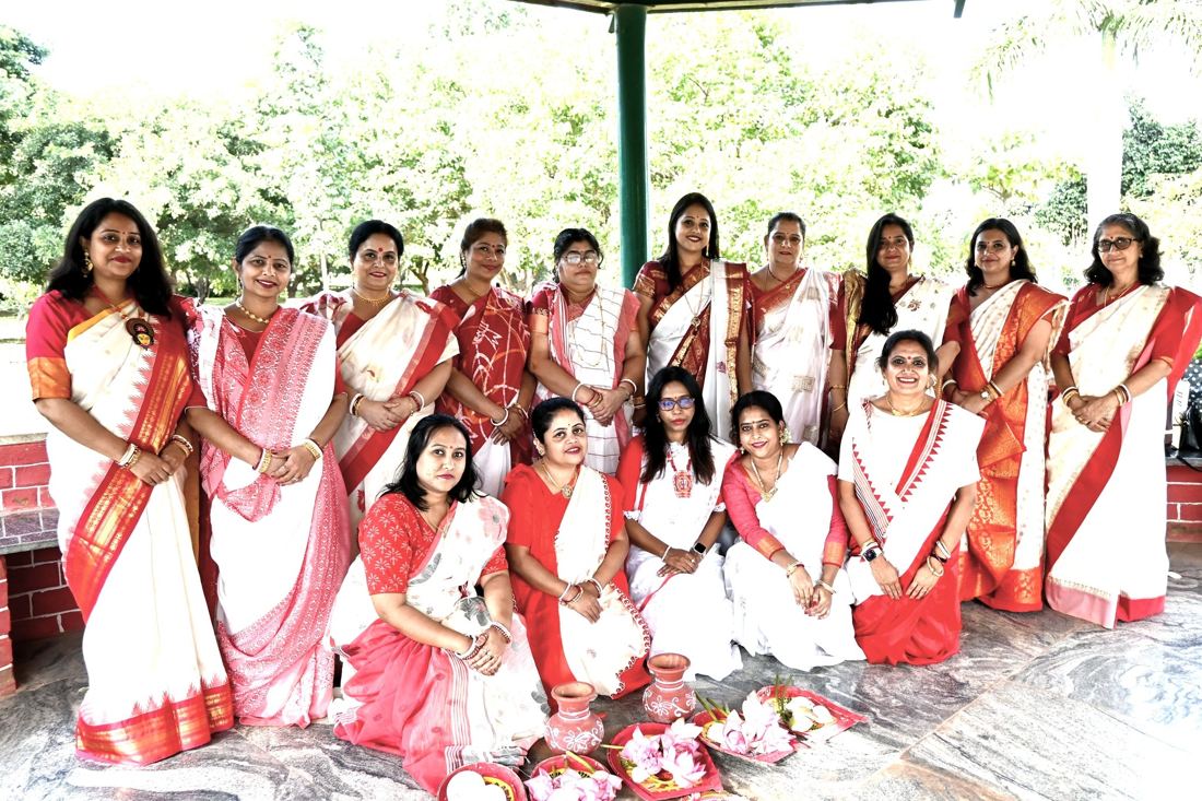 Group in traditional saris, Oikotan Hebbal Durgotsav Society